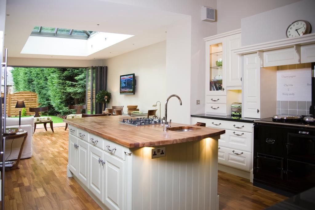 A kitchen with a large island in the middle of it.