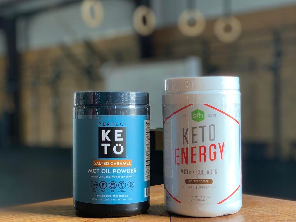 A bottle of keto energy next to a bottle of keto oil powder