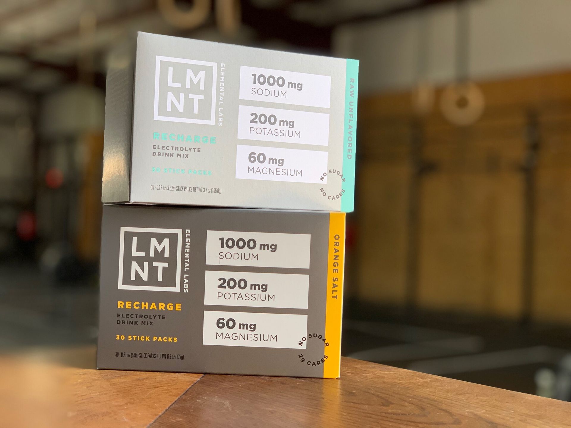 Two boxes of lm nt are stacked on top of each other on a wooden table.