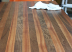 White tissues on a striped wooden table floor with a blue wall in the background