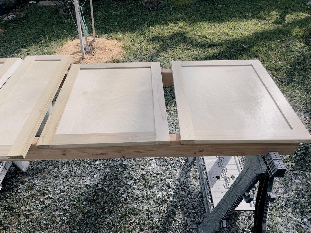 A wooden table with a few pieces of wood on it