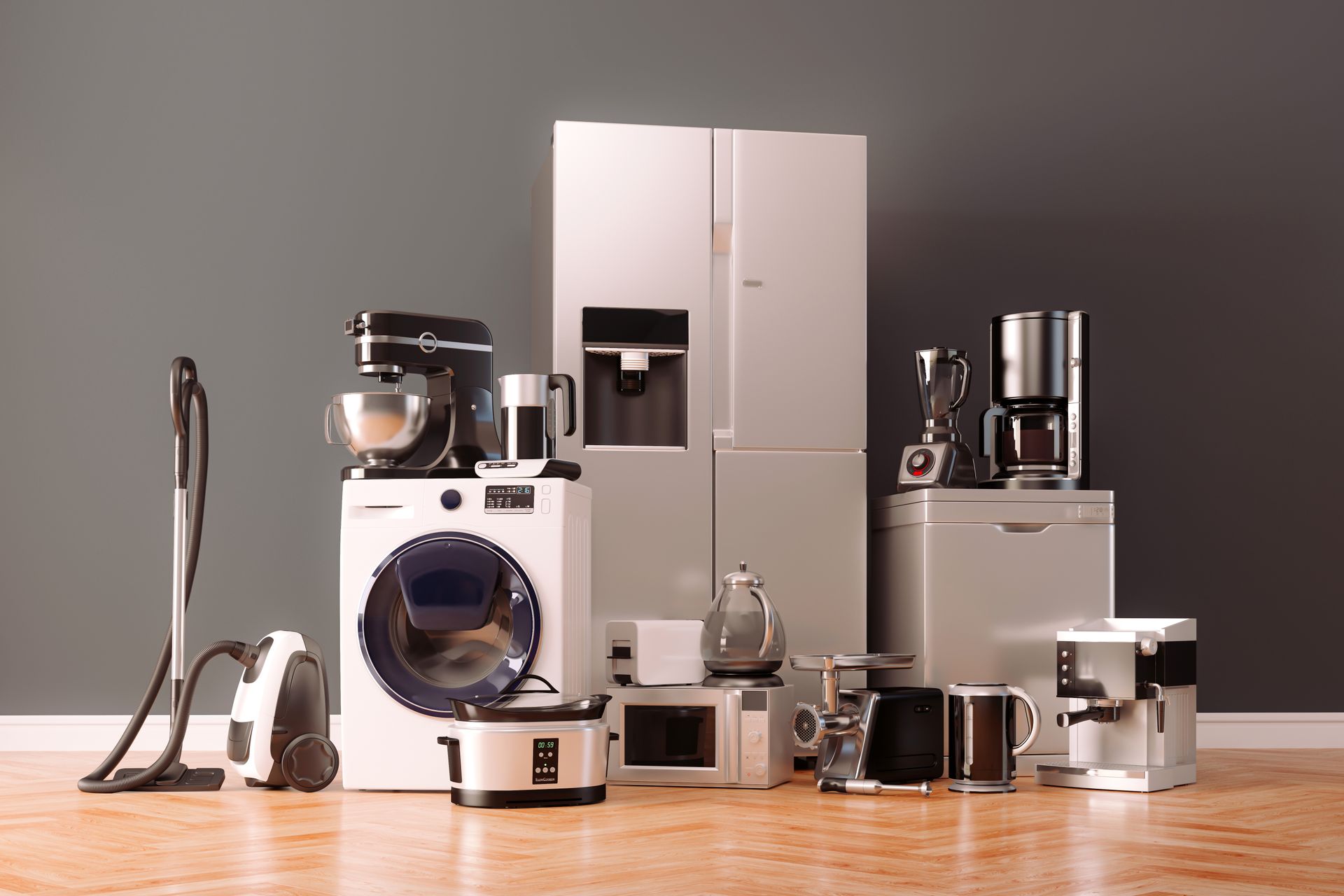 A bunch of appliances are sitting on a wooden floor.