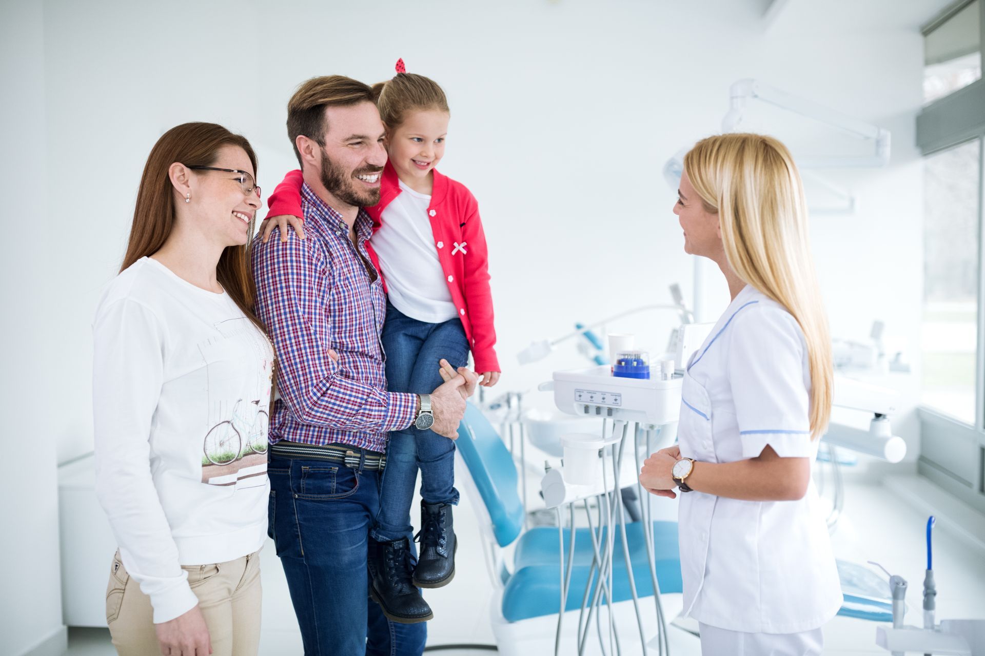 Family visiting the dentist during a routine dental checkup. Family visiting the dentist during a routine dental checkup.