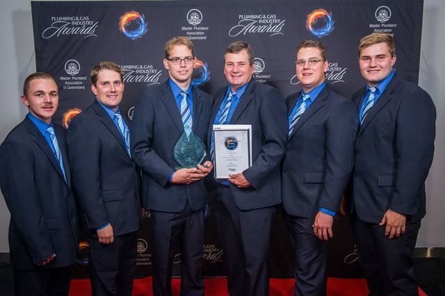 James Giles Plumbing Pty Ltd Team celebrating their win at the 2016 MPAQ awards night. James Giles Plumbing has won the prestigious QGA Commercial and Industrial Gas Installation of the Year award at the 2016 Plumbing and Gas Industry Awards.