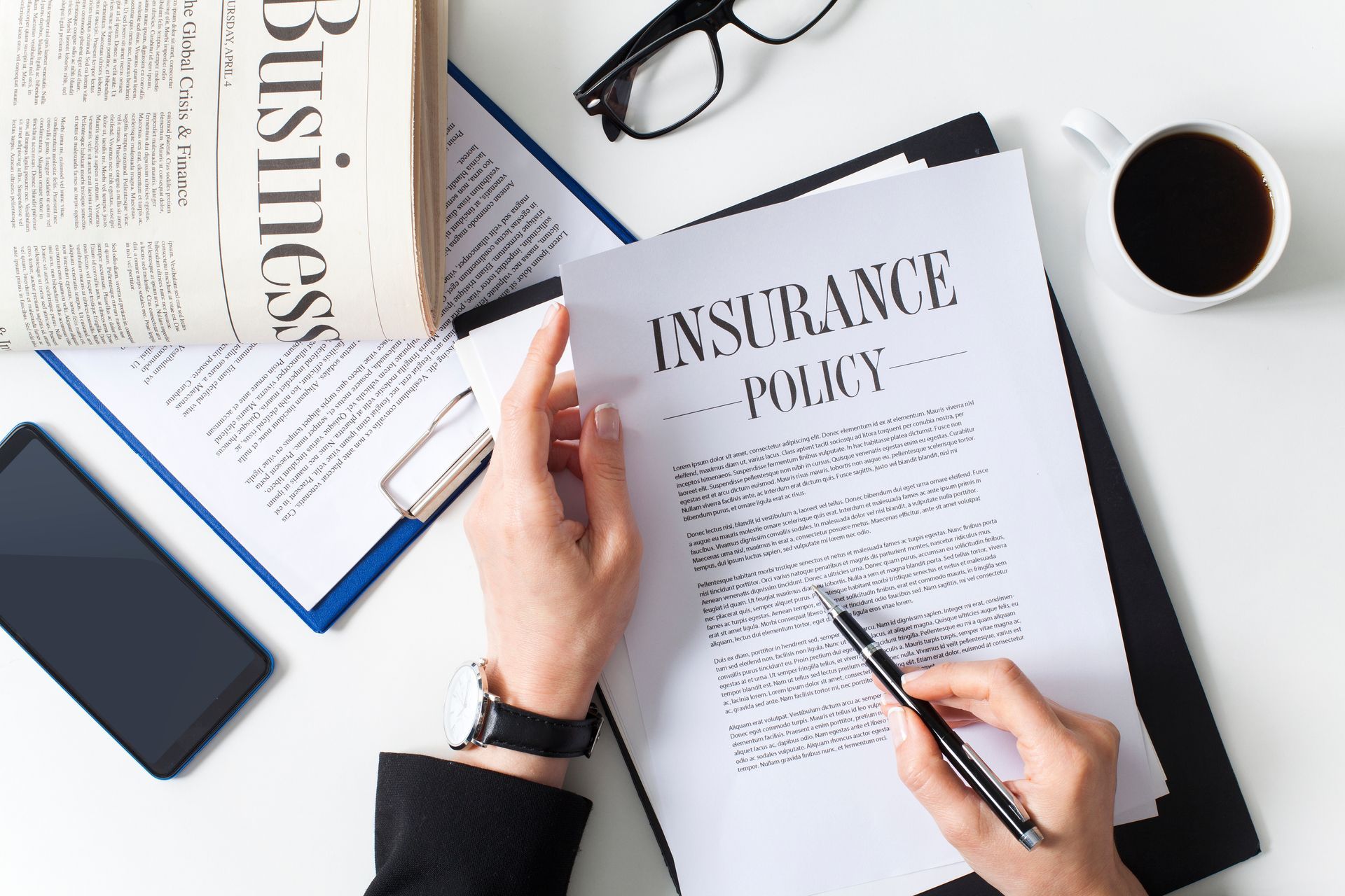 An insurance agent reviewing a customized business insurance policy.