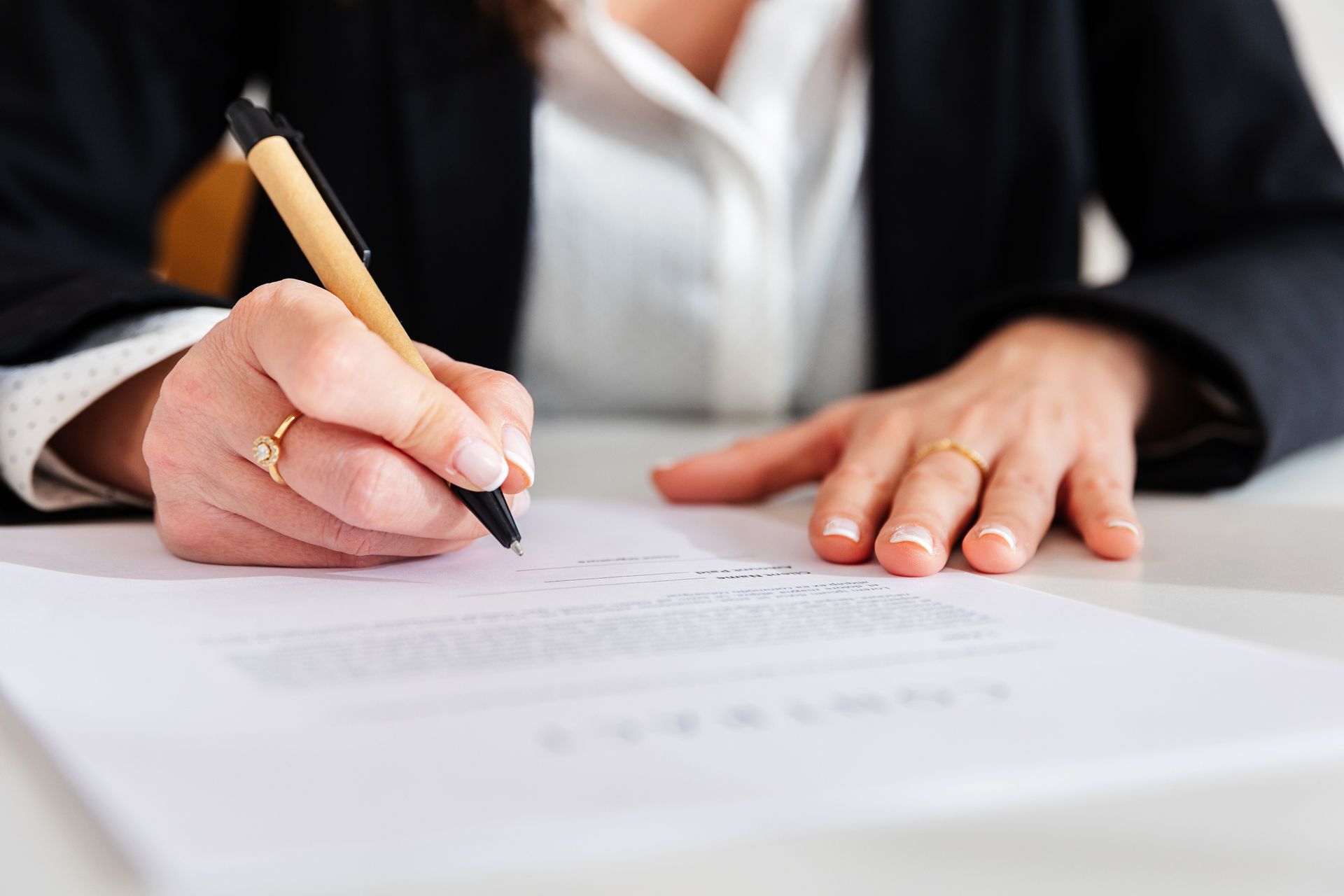 A woman signing an insurance contract