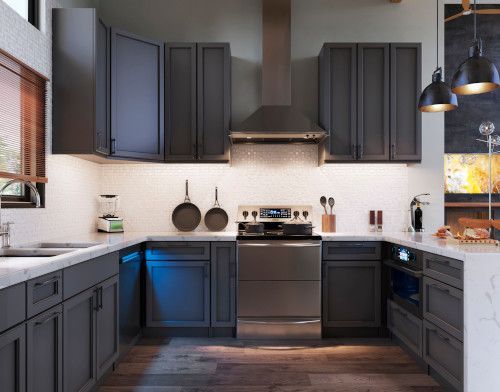 Dark gray kitchen with stainless steel appliances, light countertops, and under-cabinet lighting.