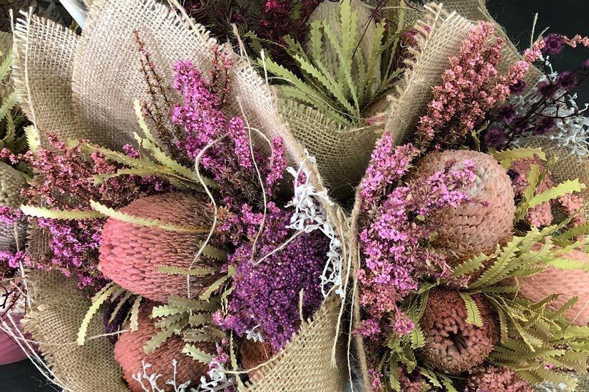 Two Bouquets of Dried Flowers Wrapped in Burlap on a Table — Suncoast Flowers in Birtinya, QLD