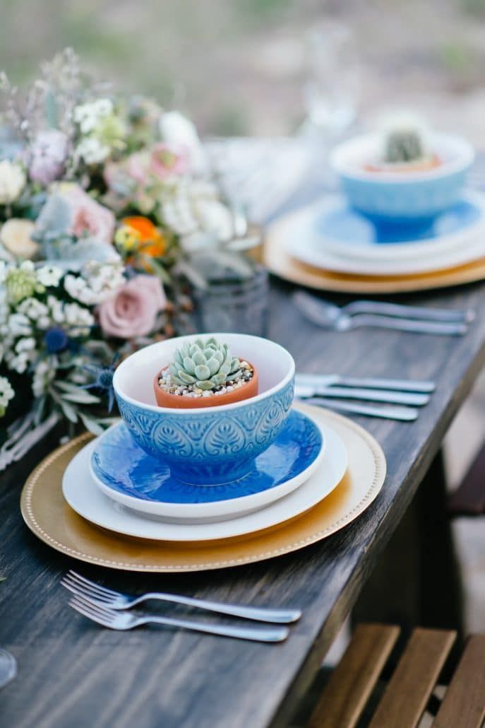 A Wooden Table With Plates Bowls, and Silverware on It — Suncoast Flowers in Birtinya, QLD