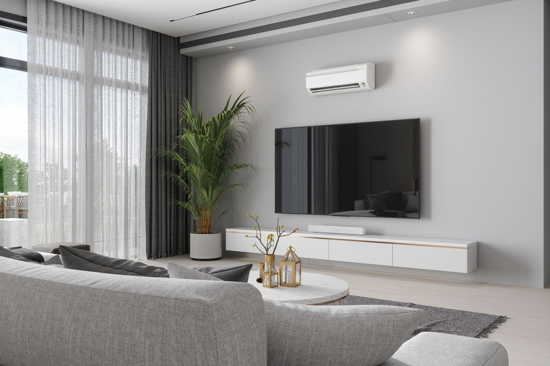 Modern living room with gray sofa, wall-mounted TV, potted plant, and large windows with sheer curtains
