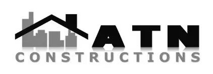 ATN Constructions logo with black house roof over gray skyline