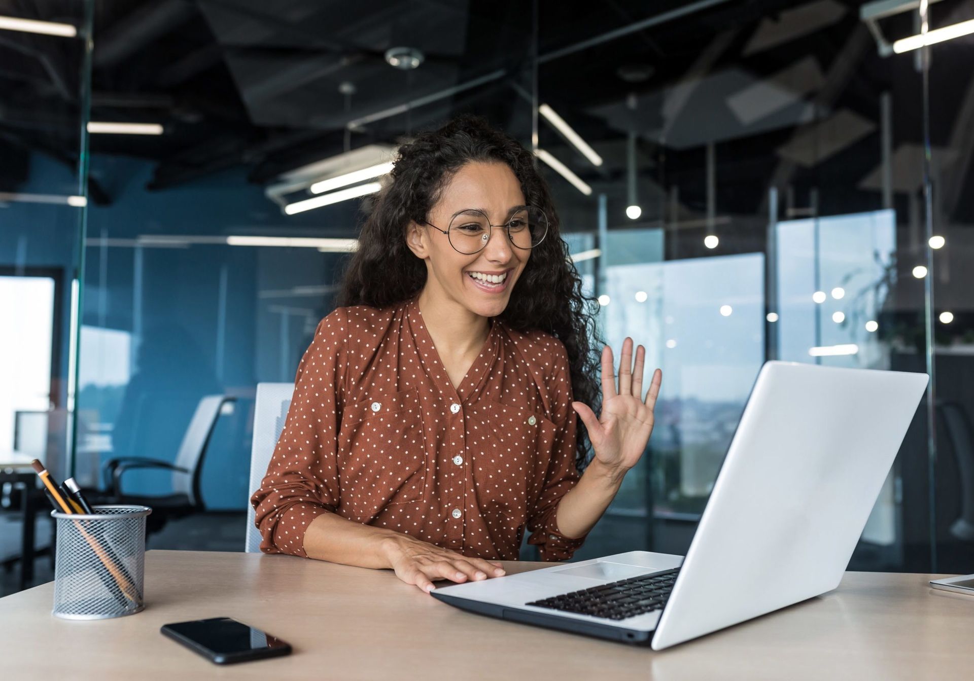 Successful hispanic woman working inside modern office building Successful hispanic woman working inside modern office building