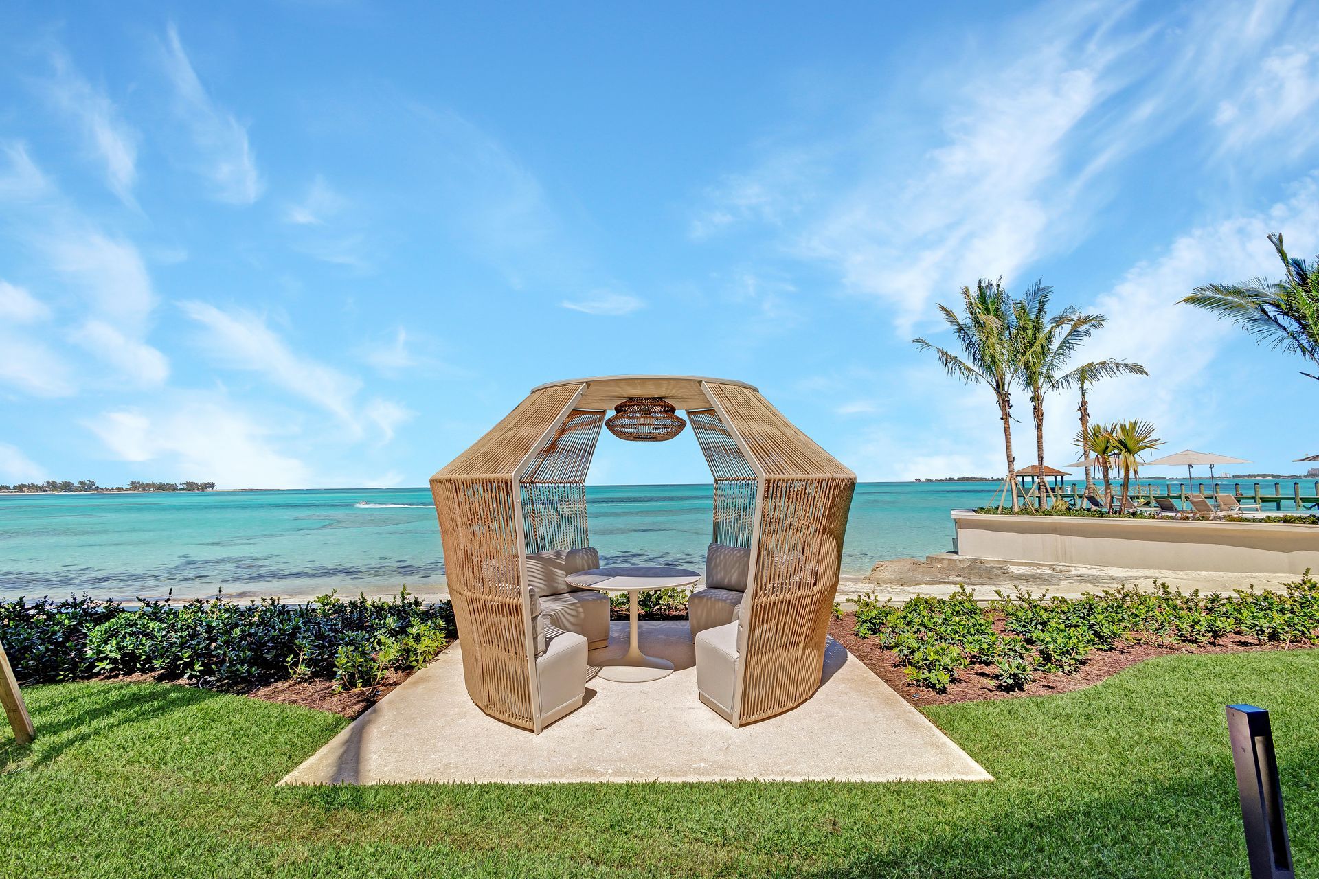 An artist 's impression of Aqualina lobby with a reception desk and chairs in Nassau Bahamas