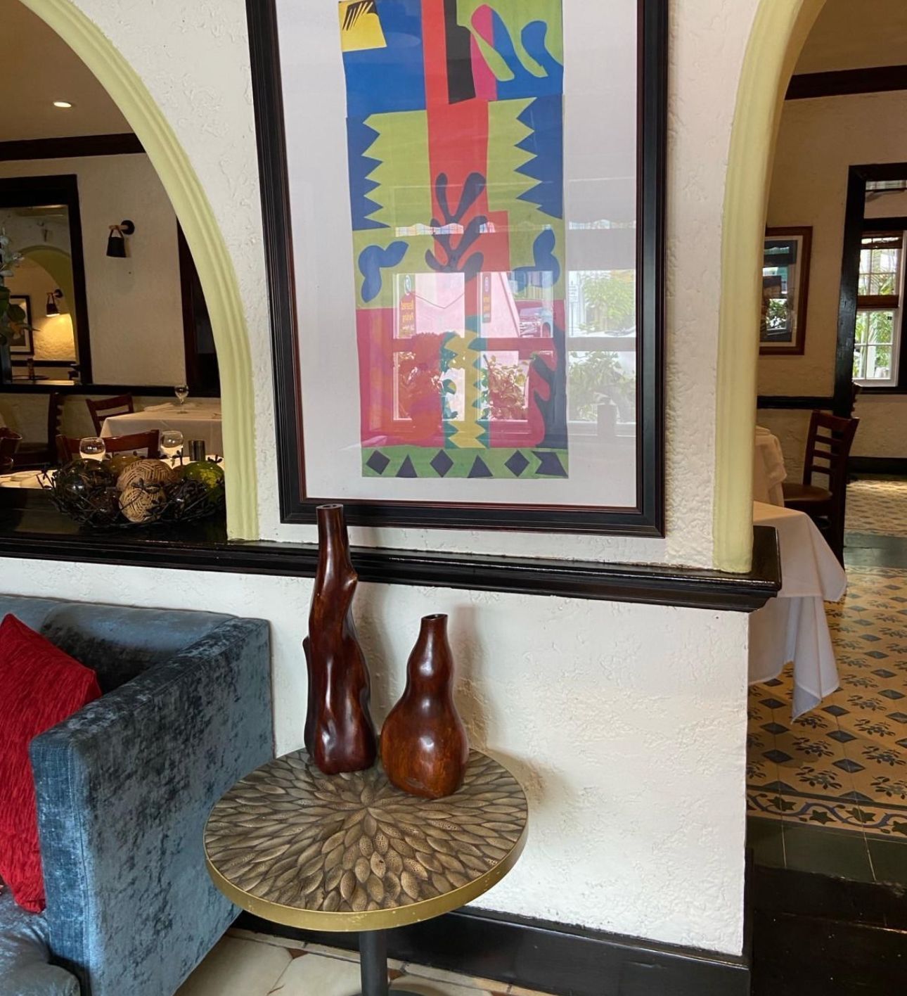 Cafe Matisse restaurant with a picture on the wall above a table in Nassau, Bahamas