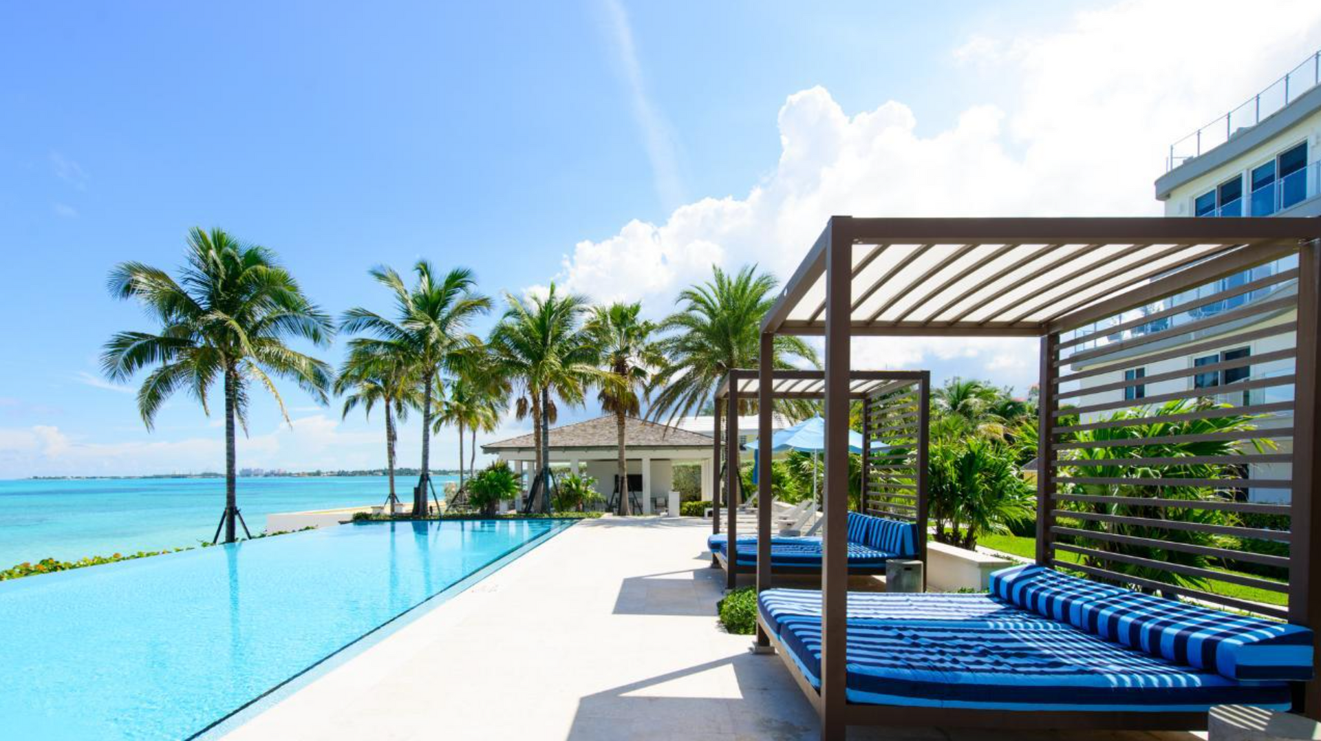Spacious kitchen featuring island workspace in One Cable Beach condo in Nassau, Bahamas