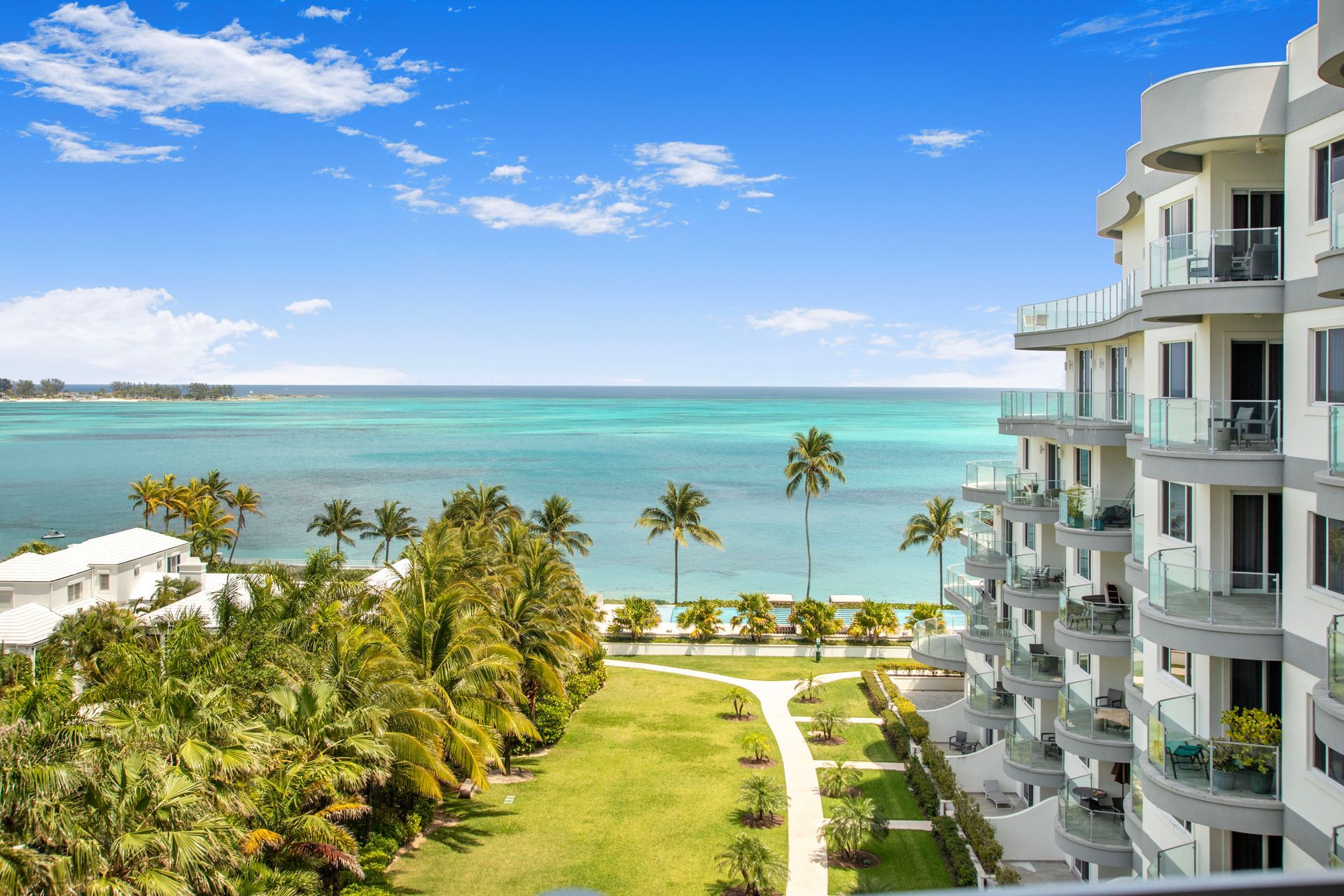 One cable beach view of the ocean and palm trees in Nassau Bahamas