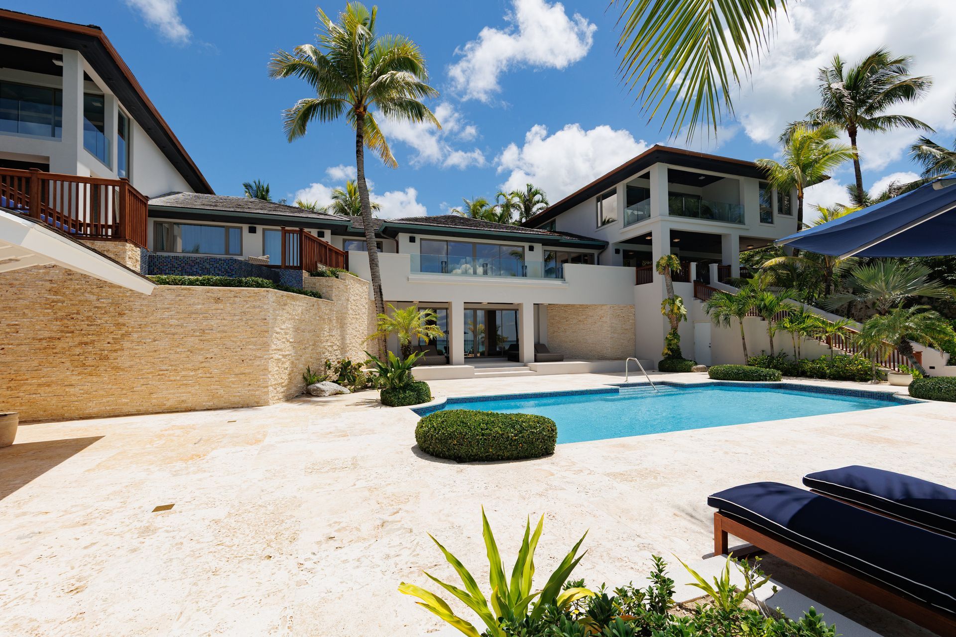 One cable beach property  with a swimming pool in front of it in Nassau Bahamas