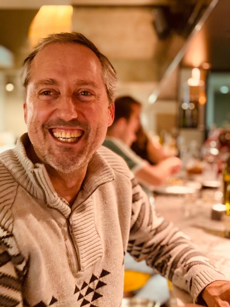 Tapas bar owner smiling
