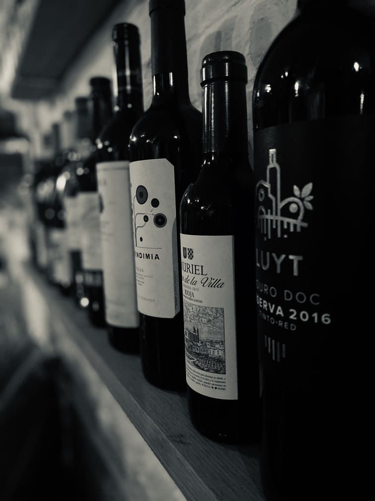Black & white image of wines on a shelf
