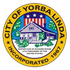 Seal of Yorba Linda, California: circular with a house, flag, stars, and text