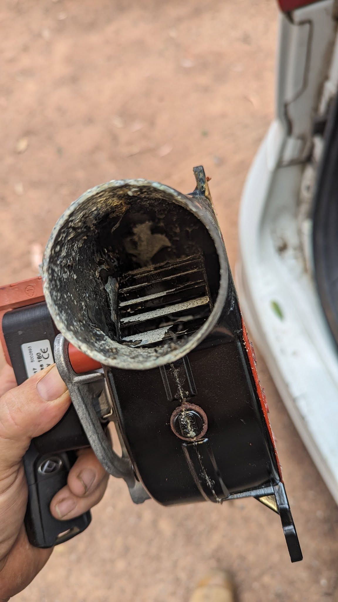 Hand Holding A Dirty Vacuum Cleaner Filter — Escarpment Air in Southern Highlands, NSW