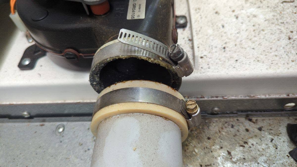 Close-up Of A White Pipe Joined With Metal Hose — Escarpment Air in Southern Highlands, NSW
