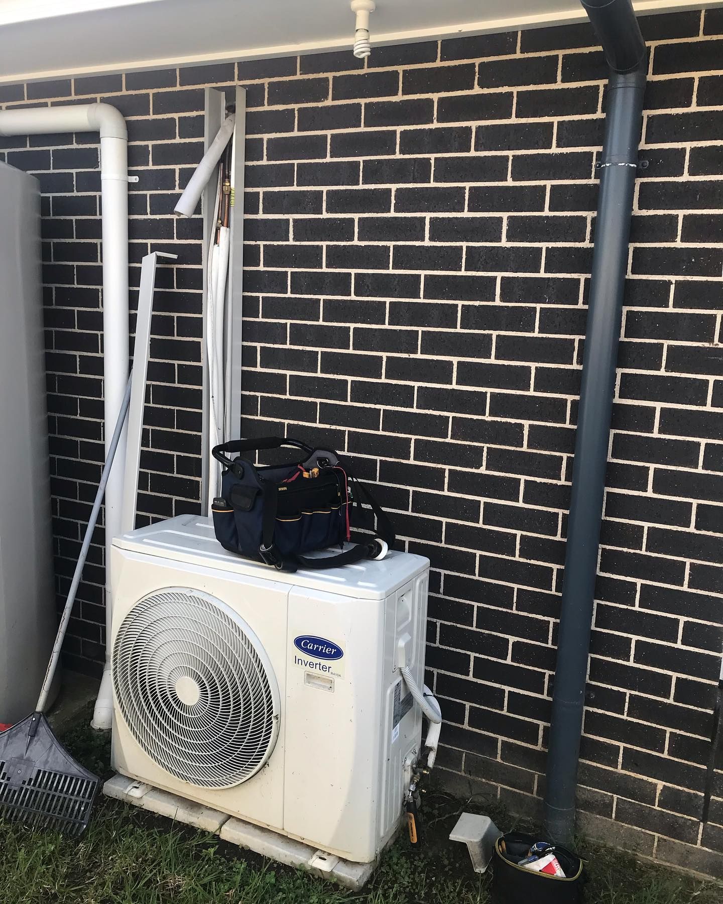 Air Conditioning Unit Against a Brick Wall — Escarpment Air in Mount Saint Thomas, NSW