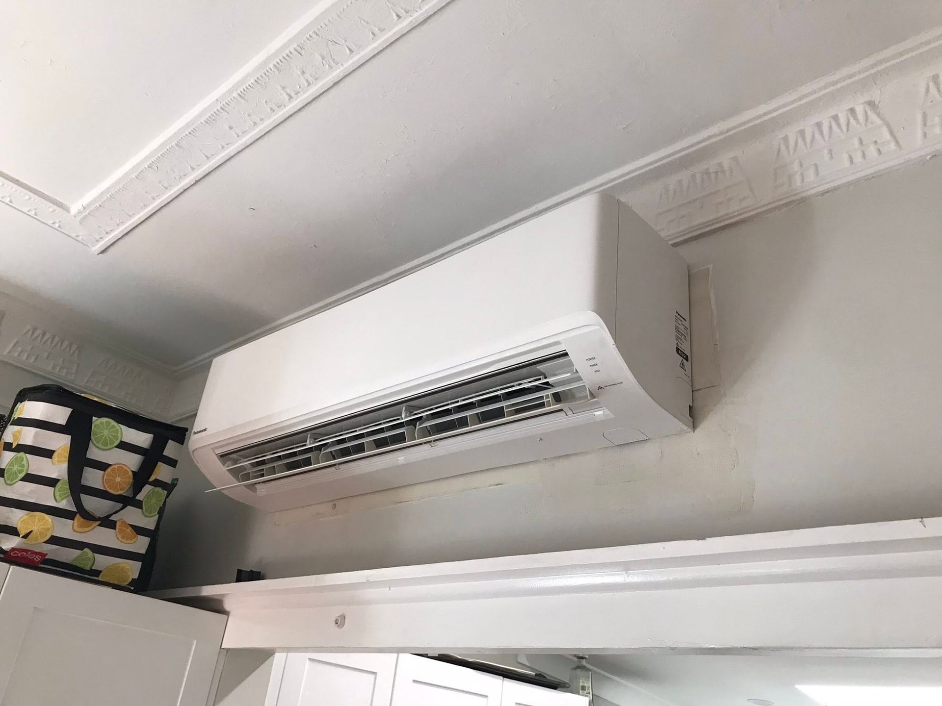 Wall-mounted Air Conditioner In A Plain White Room — Escarpment Air in Mount Saint Thomas, NSW