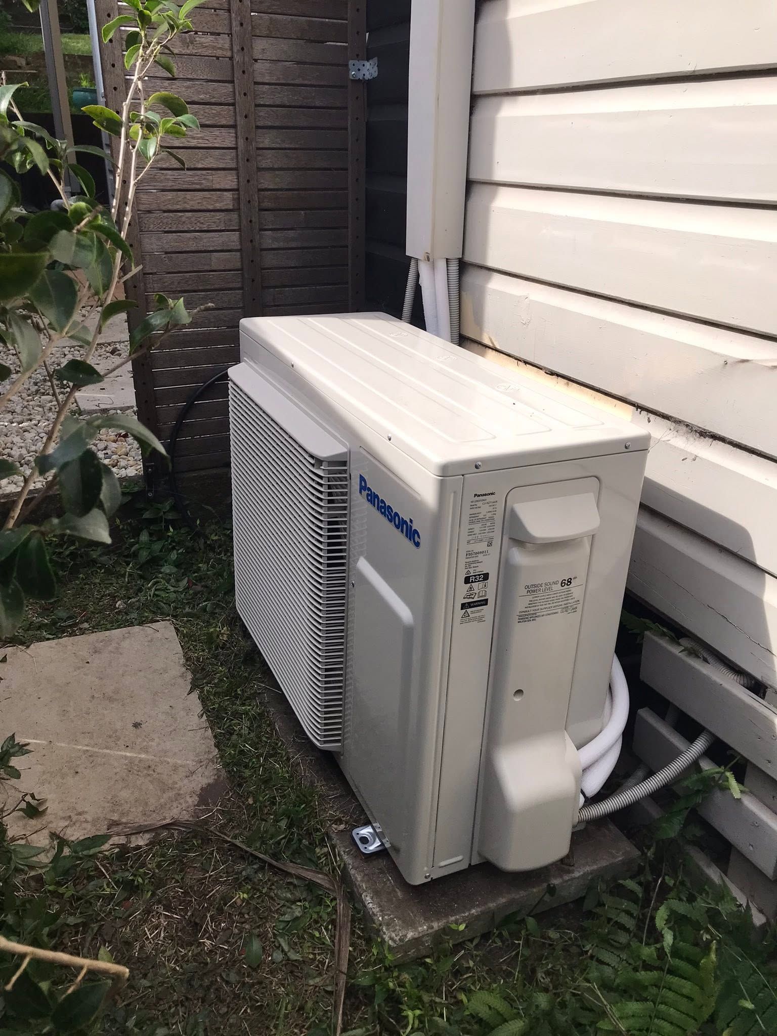 Outdoor Air Conditioning Unit Beside A White House — Escarpment Air in Dapto, NSW