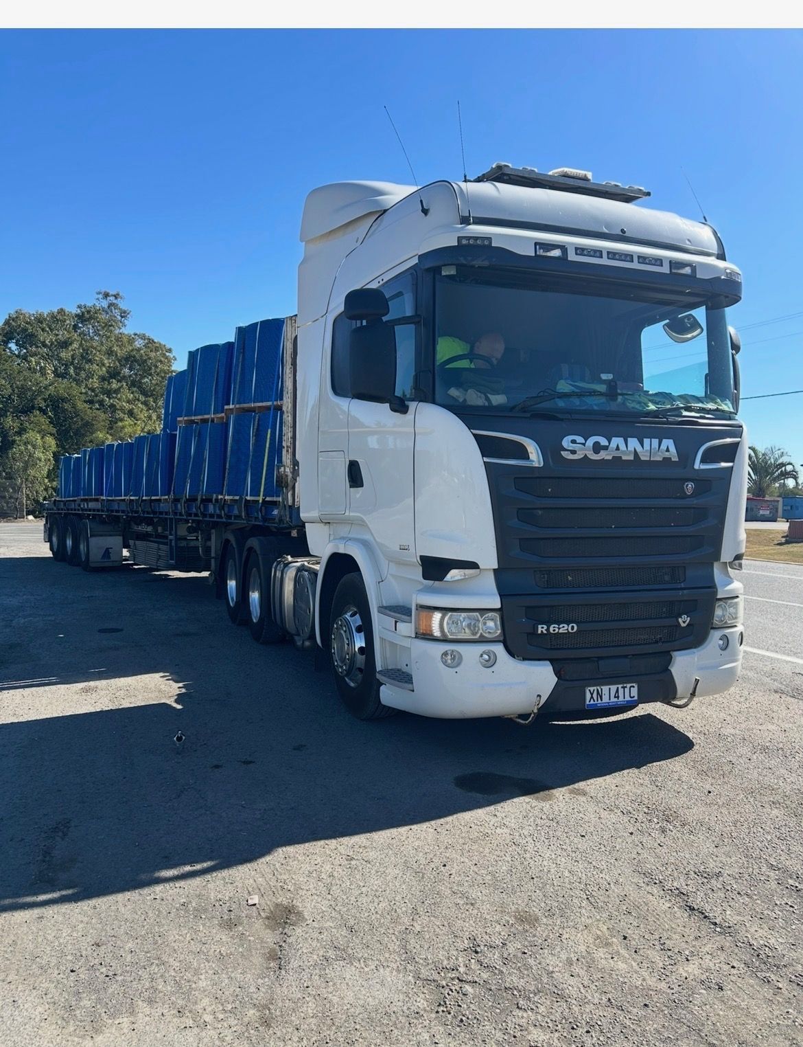 White Scania Semi-truck Hauling Blue Cargo on a Sunny Road — Western Pacific Operations in Kremnos, NSW
