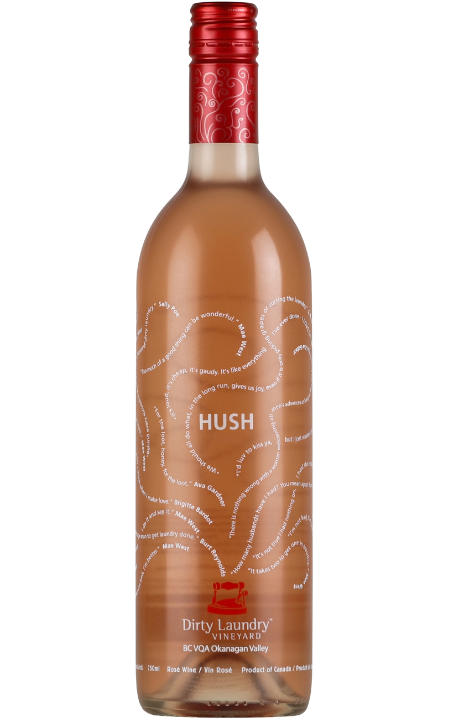 A bottle of hush wine with a red cap