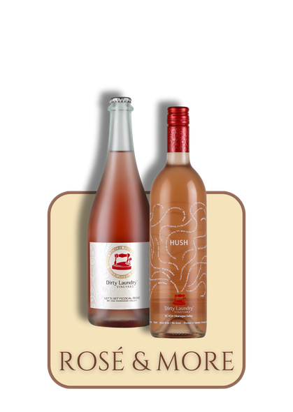 Two bottles of rosé wine are sitting next to each other on a table.