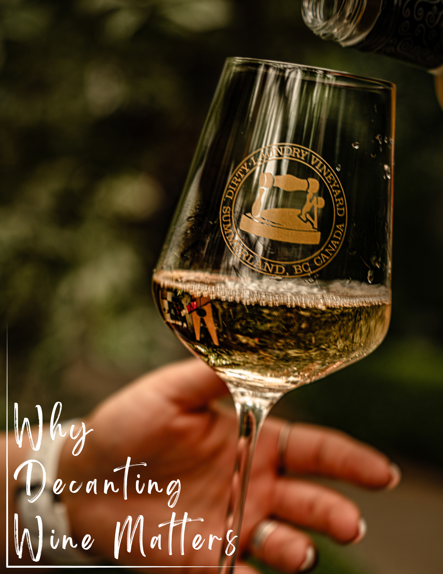 Wine being poured into a branded glass, held by a hand. Text reads