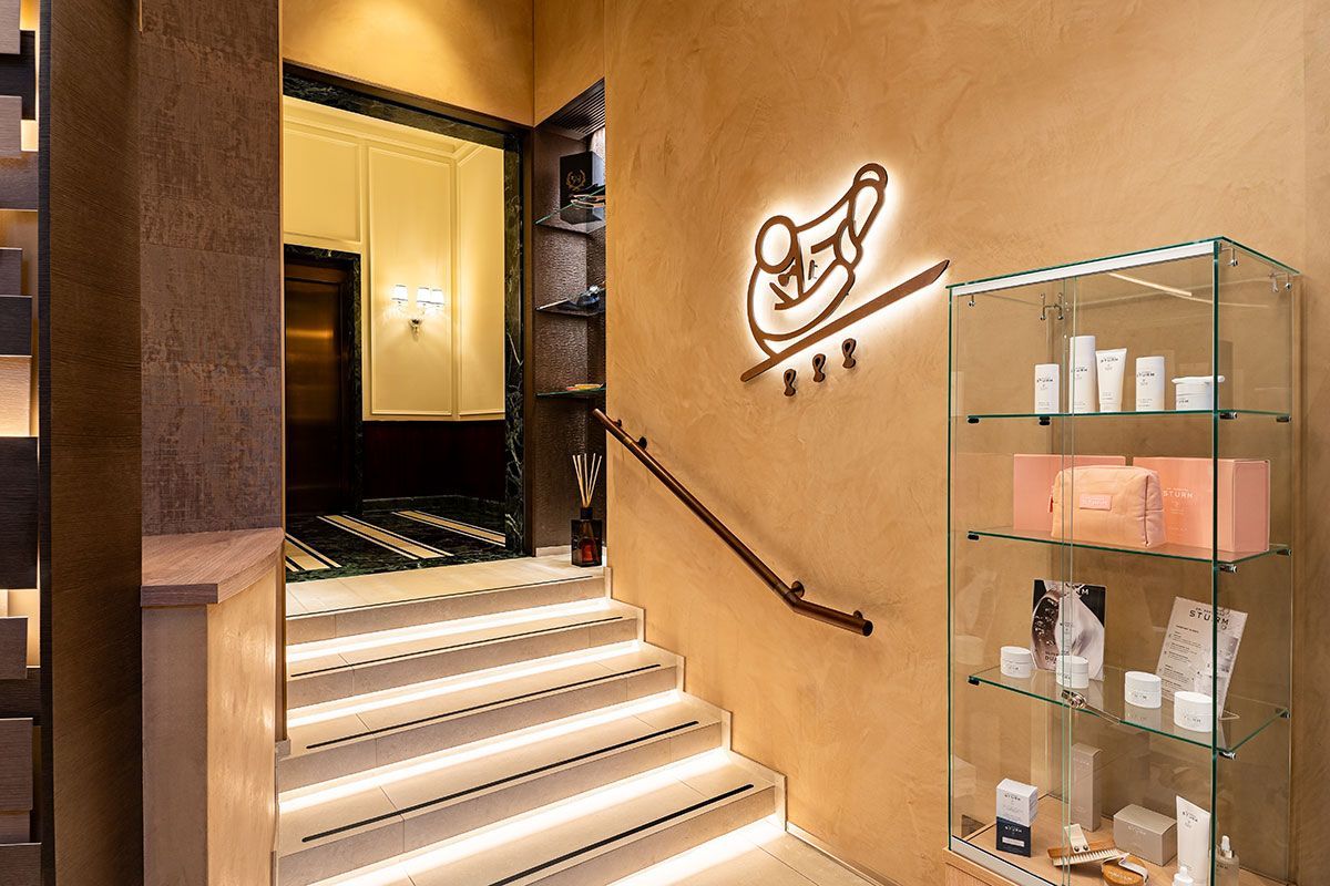 Casa Cipriani Milano spa lobby with luxury skincare retail selection, offering premium beauty products in a stylish setting.