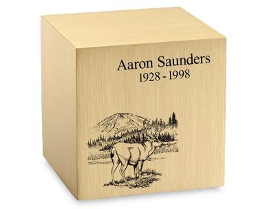 A wooden cube with a picture of a deer on it.