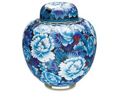 A blue and white vase with flowers on it