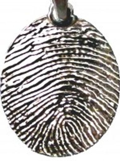 A silver pendant with a fingerprint on it.
