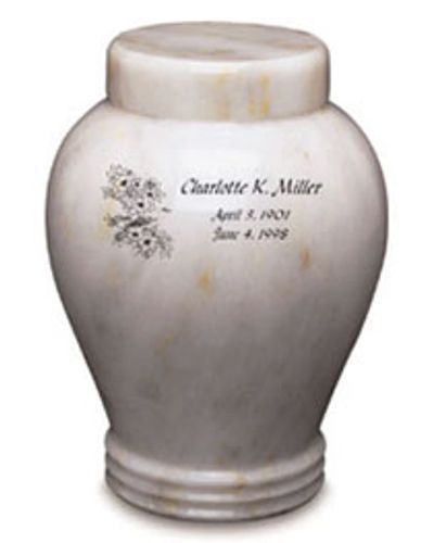 A white urn with the name charlotte k. miller on it