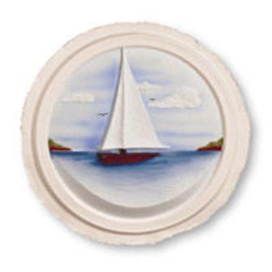 A painting of a sailboat in the ocean on a white plate.