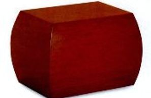 A red cube is sitting on a white surface.