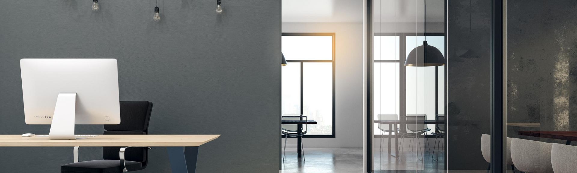 Modern office interior with a desk, computer, glass doors, and a wall mirror leading to a bright room