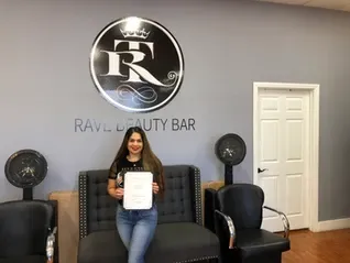 Woman holding her certificate | Sylmar, CA | Rave Beauty Bar