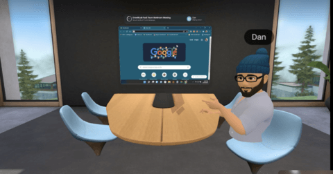 a man is sitting at a table in front of a computer screen .