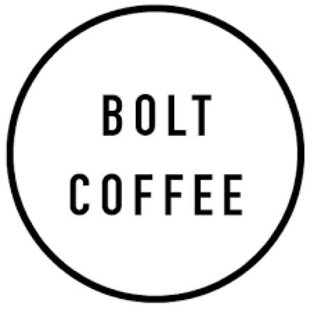 the bolt coffee logo is a black and white circle with the words bolt coffee written inside of it .