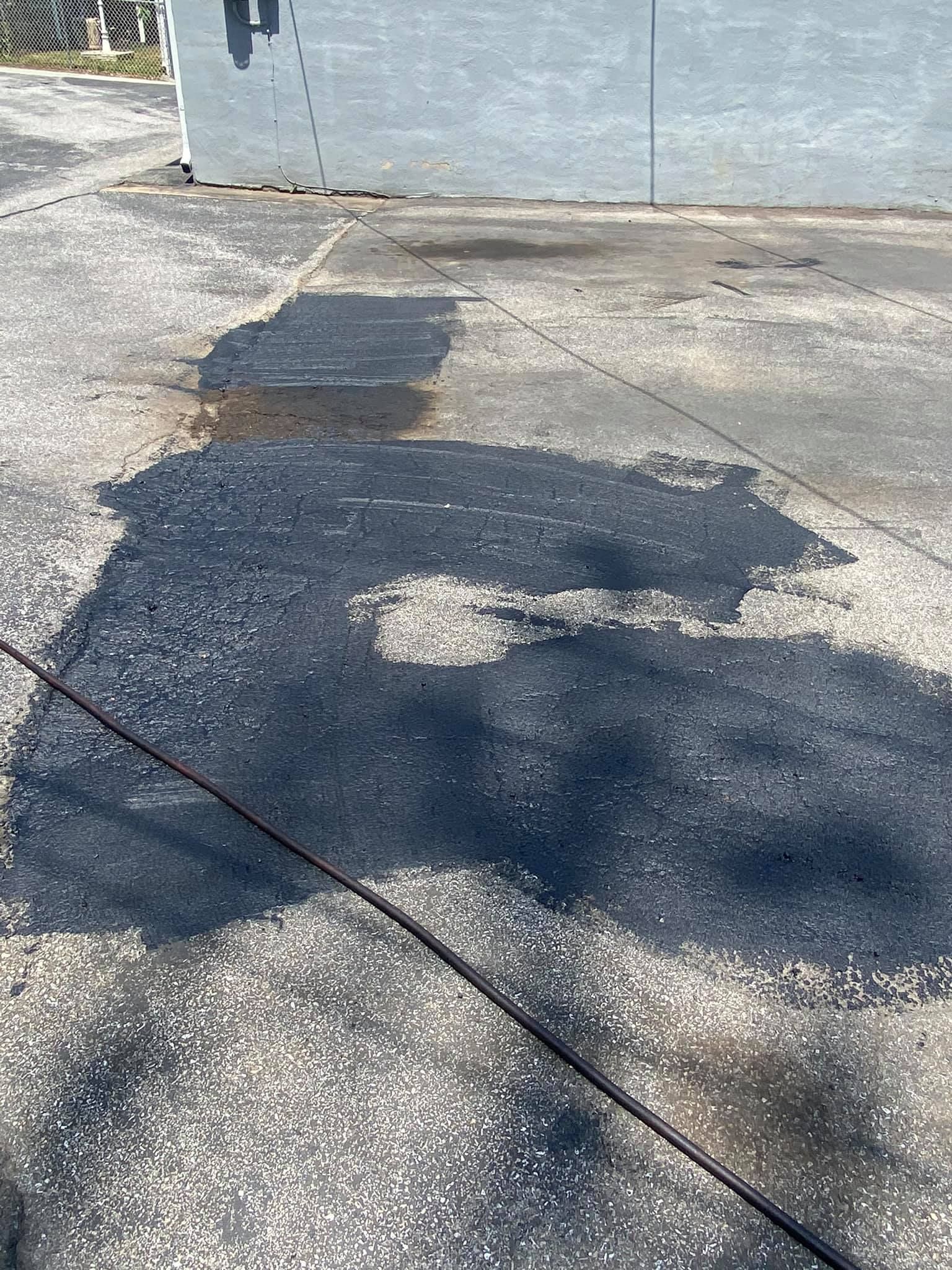 A shadow of a person is cast on a concrete surface.