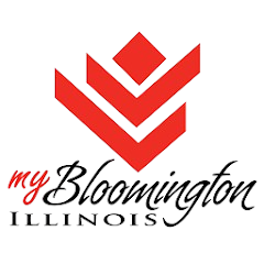 Red logo for "my Bloomington Illinois" with stylized leaf-like symbol above the text.