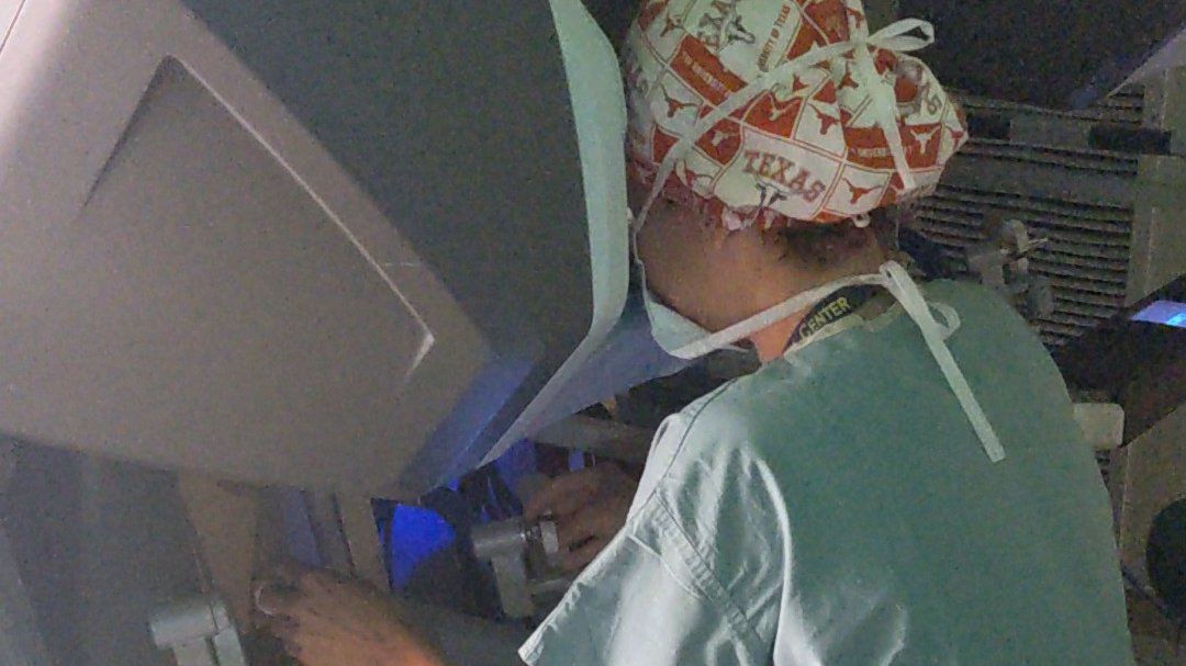 Ritha Belizaire, MD, performing robotic colorectal surgery at the surgeon console
