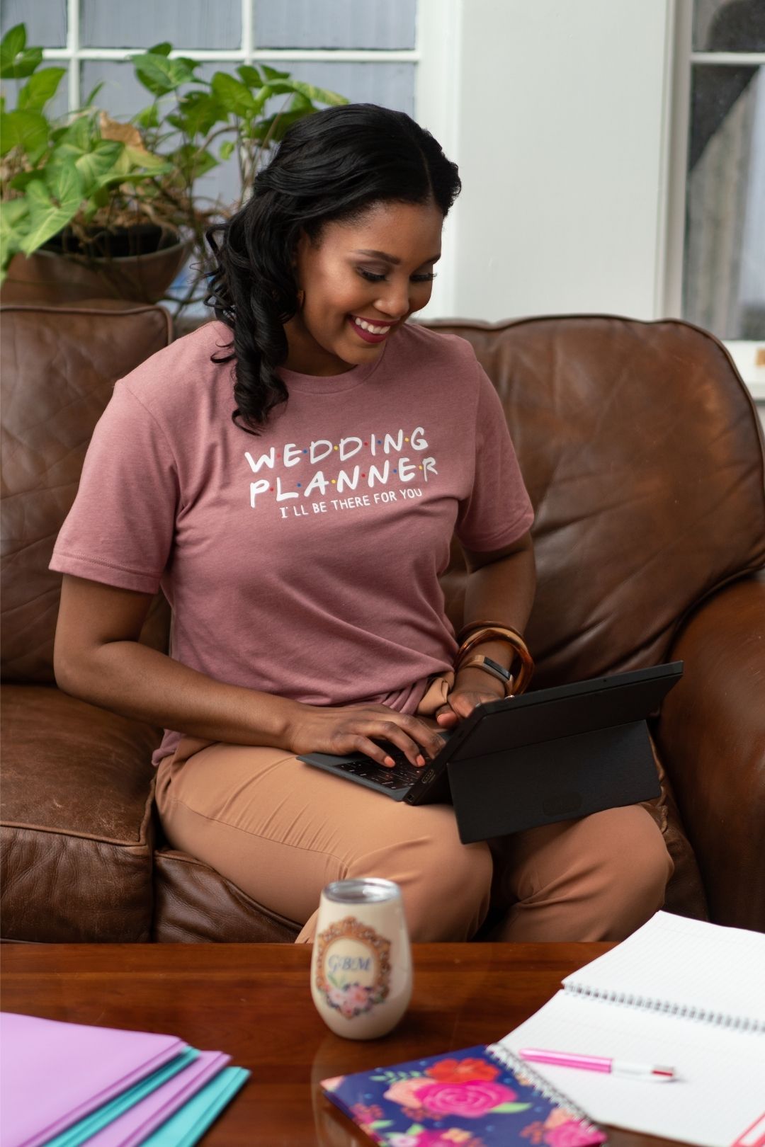 West Virginia Wedding Planner working on computer for clients