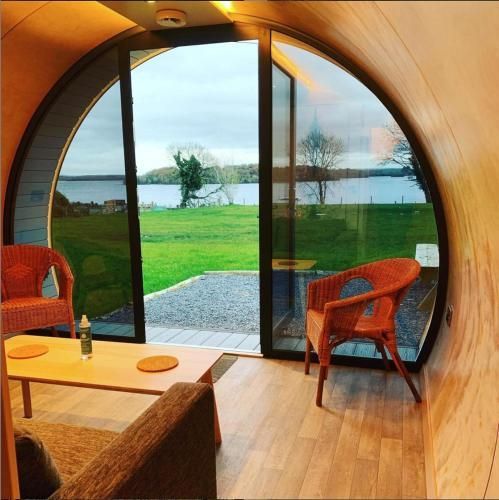 A living room with a view of a lake