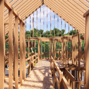 Wood-framed house interior under construction with exposed rafters and open wall framing overlooking trees
